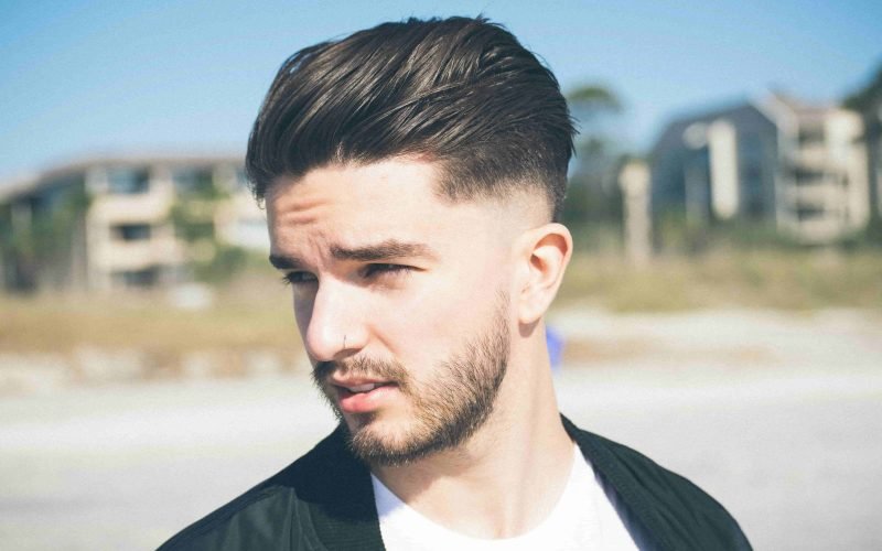 Close-up of a man's styled hair, illustrating hair care tips for men.